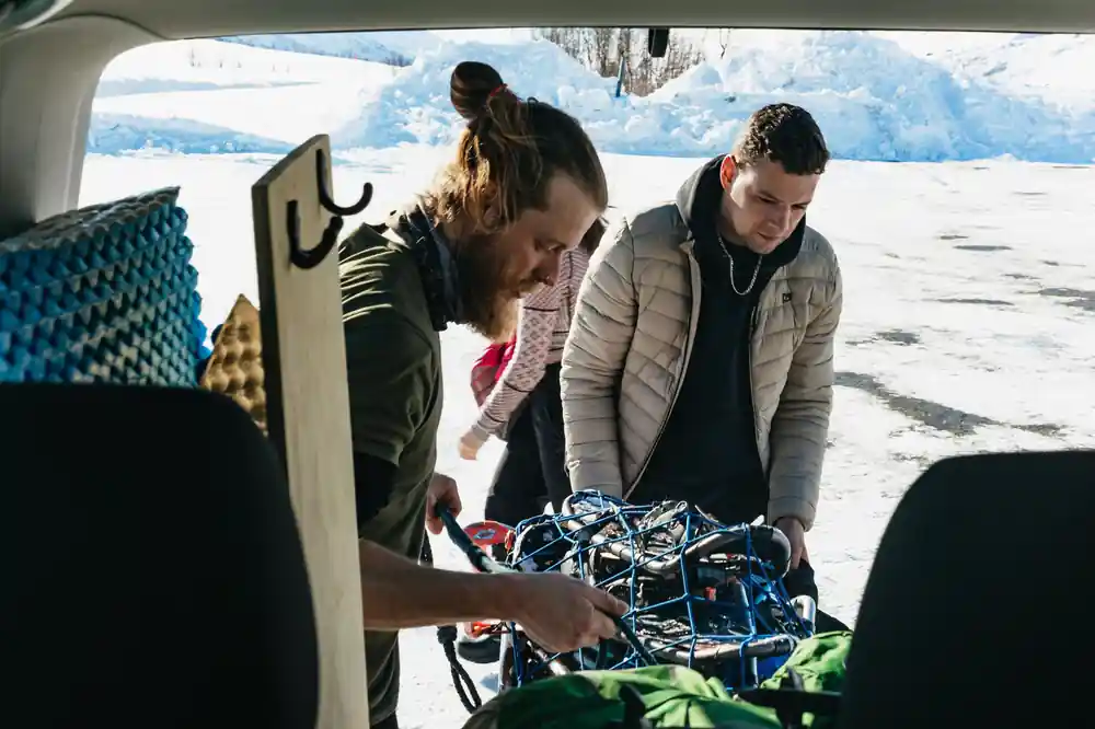 Guides sorting snowshoes and bindings before the walk