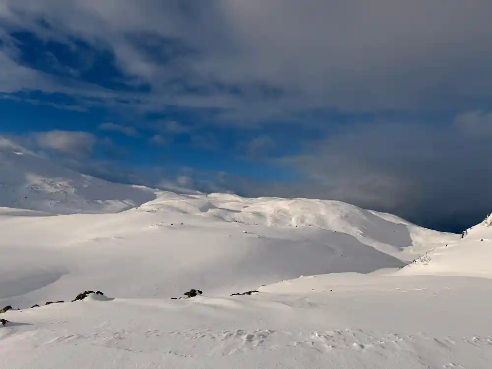 A snow dome under a bright winter sky