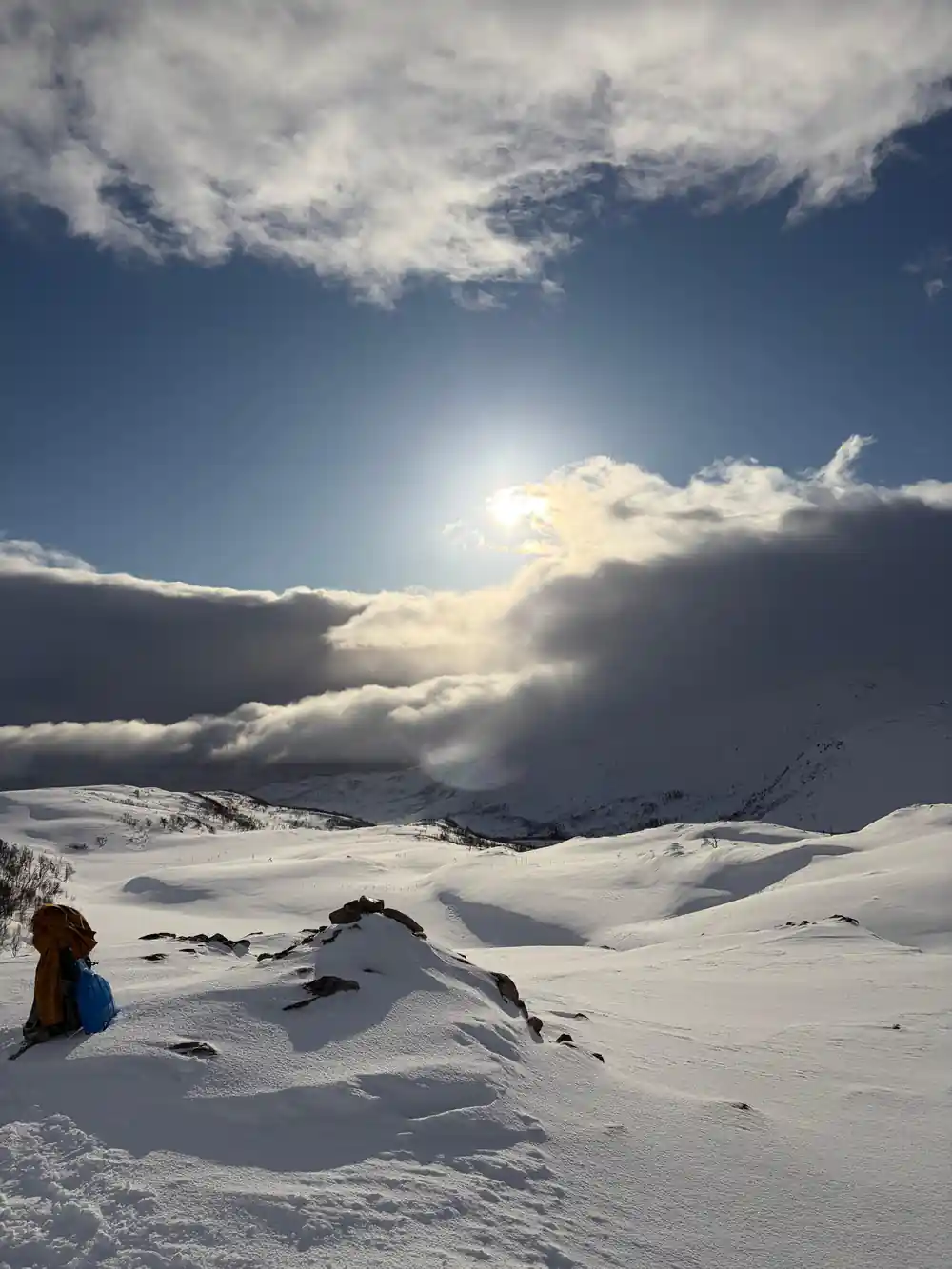 The sun breaking through cloud above the plateau