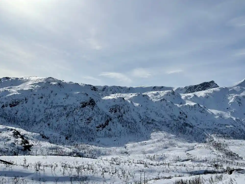 A wide white valley above the water